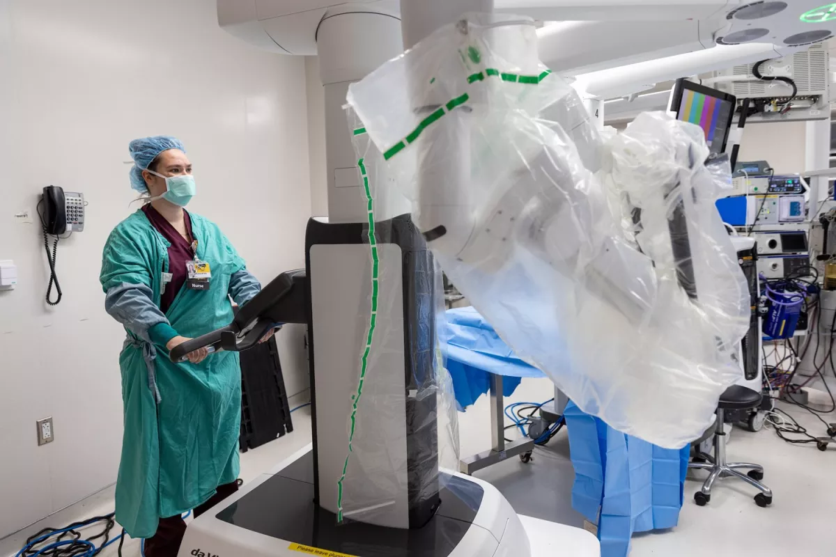 Surgical nurses are responsible for “driving” the robot to its proper place within the sterile field.