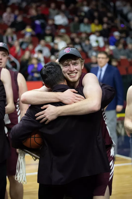 Dylan Kurt hugs coach after winning championship game