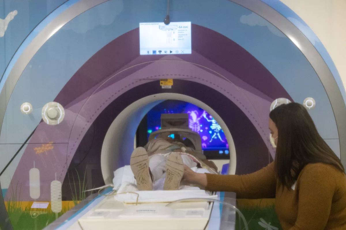 A pediatric patient is accompanied by her mother during an MRI in special wrapped MRI machines on Friday, February 24, 2023. Patient consent on file.