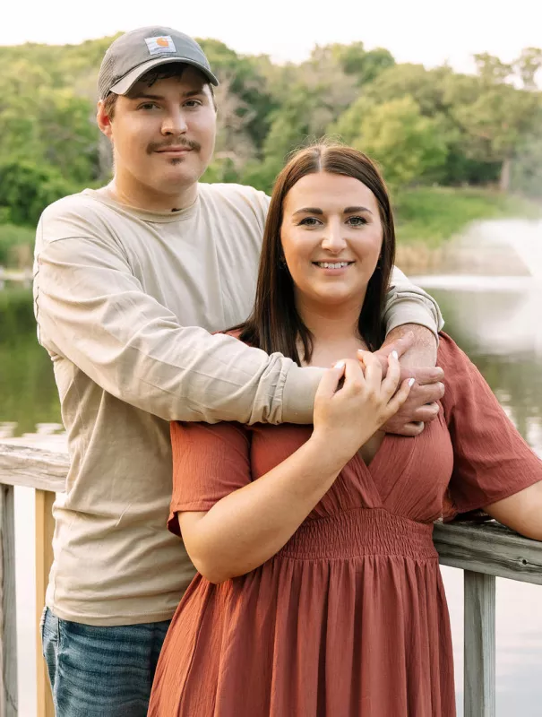 James and Mikki pose for an engagement photo in 2023