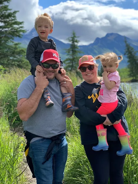 Nile Kron and his family hiking outside