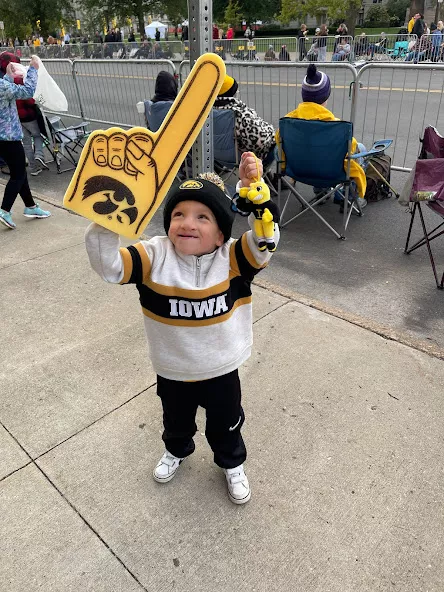 Nile Kron holding up a University of Iowa Hawkeye foam finger