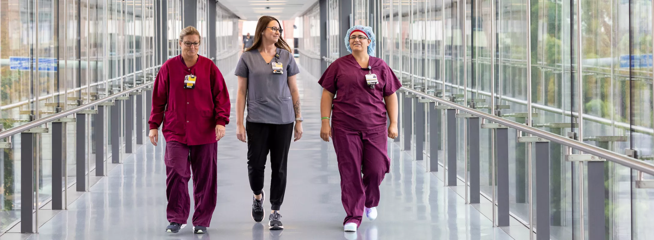 AED nurses walking down the skywalk