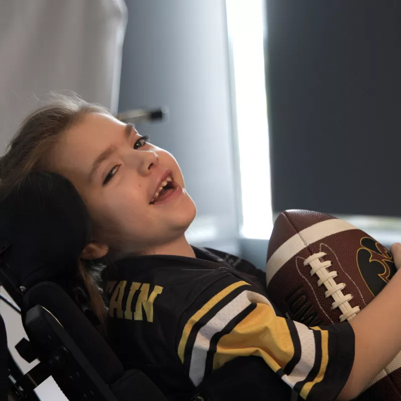 Maggie poses with the hawkeye football