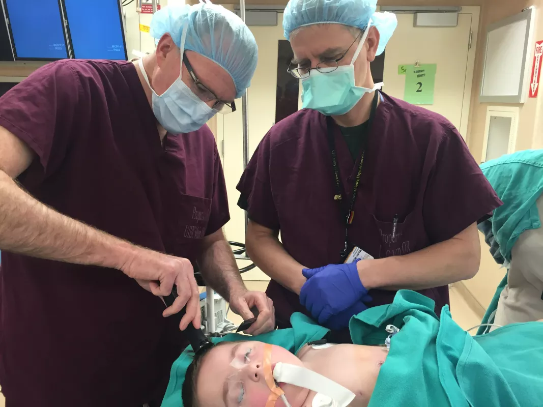 Kid Captain Bentley Erickson and care team during one of his numerous surgeries