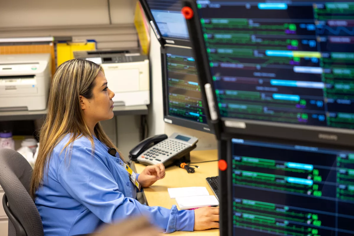 CMU employee monitors patients
