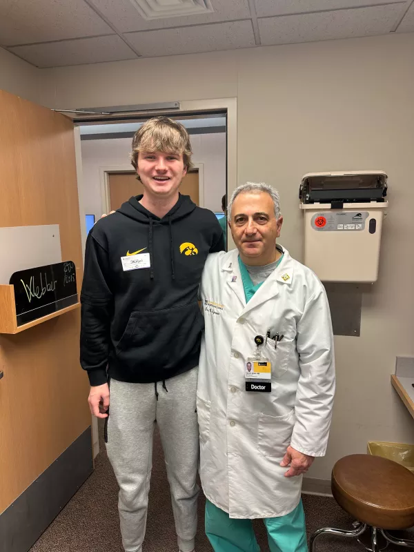 Jackson Webber with UI Health Care orthopedic surgeon Cassim Igram, MD, during a follow-up visit.