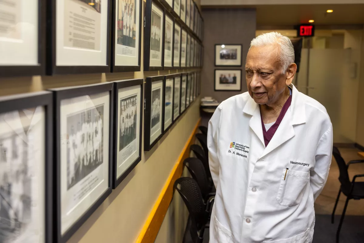 Menezes reflects on group photos of former faculty and trainees in the Department of Neurosurgery.