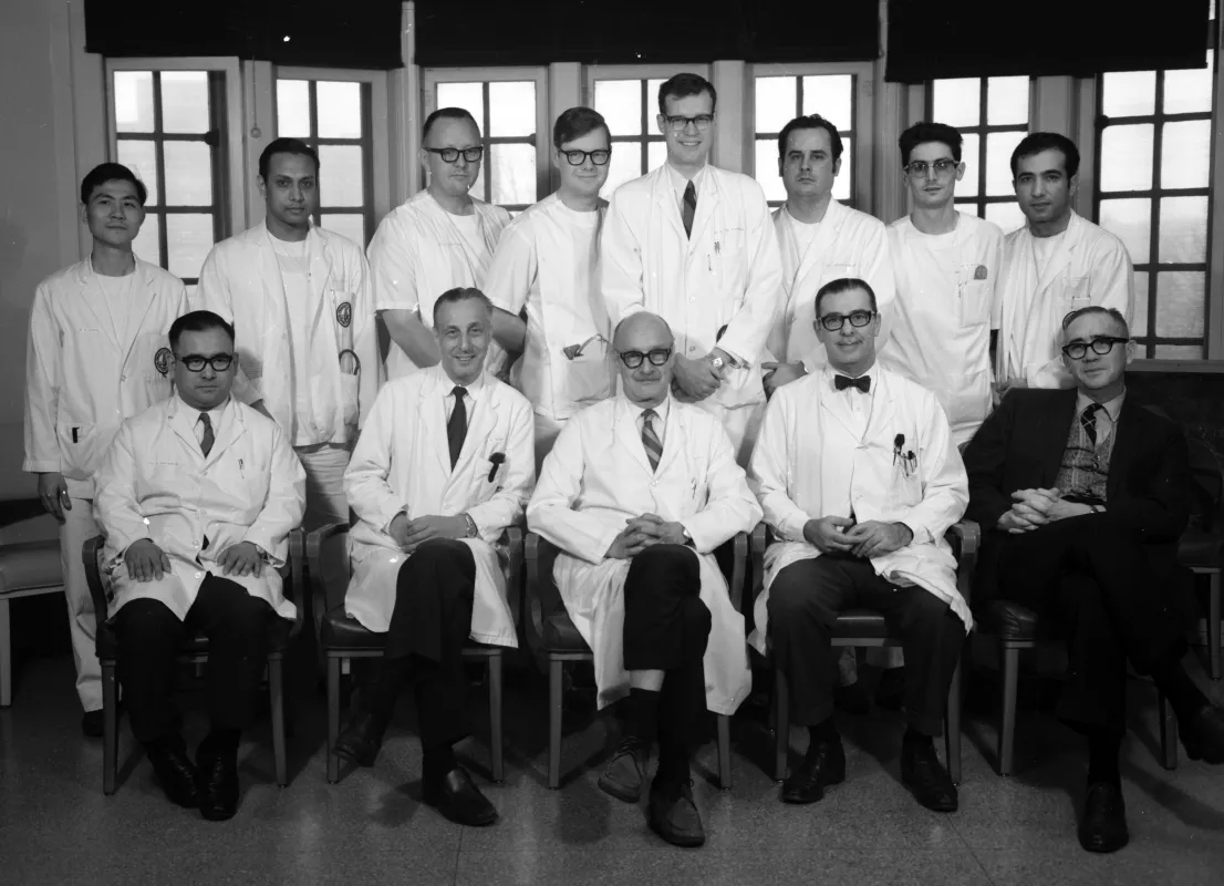 Black and white photograph of Arnold Menezes and University of Iowa Residents