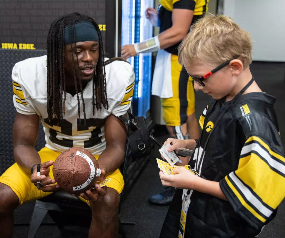 Carter with defensive back Jermari Harris during Kids Day 