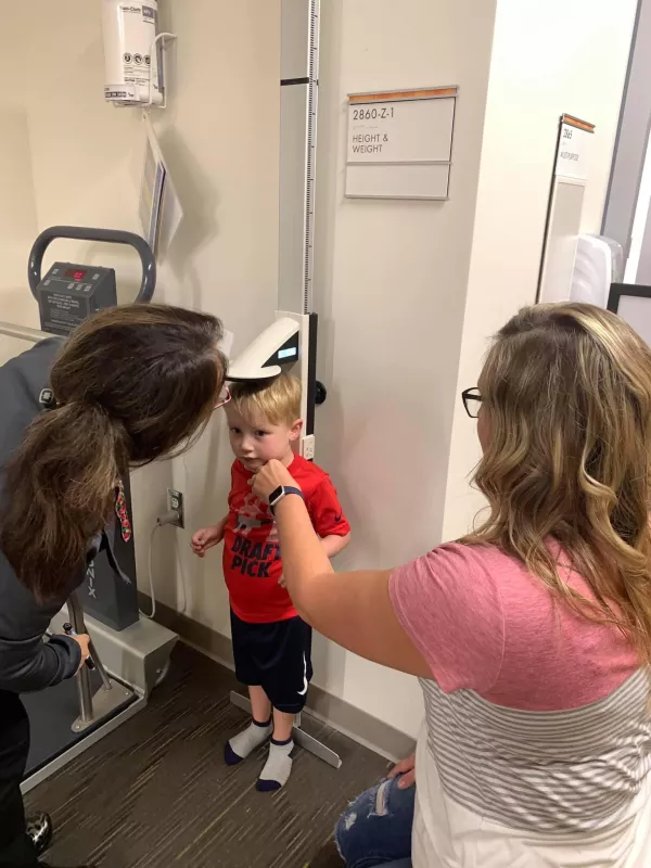 Kid Captain Aiden Washburn in hospital getting his height checked