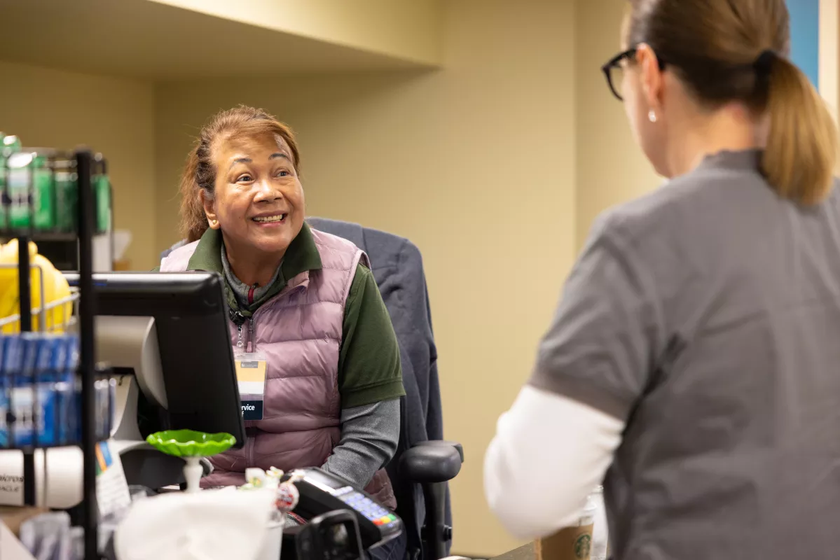 Food and Nutrition cashier, Juliet Moore, helps ring up an order for a UI Health Care staff member on Tuesday, April 11, 2023.