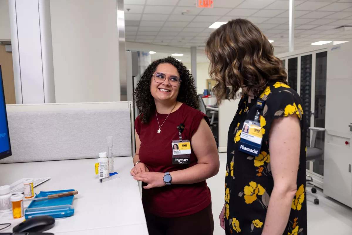 Pharmacy technician Stephanie Ray and pharmacist Abby Meyer, PharmD, with medication for a simulated patient in the pharmacy at UI Health Care Medical Center North Liberty on Friday, Feb. 28, 2025.