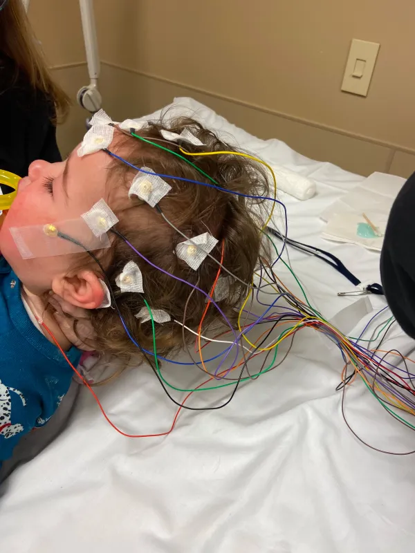 Kid Captain Gwendolyn Clouse with electrodes on her head