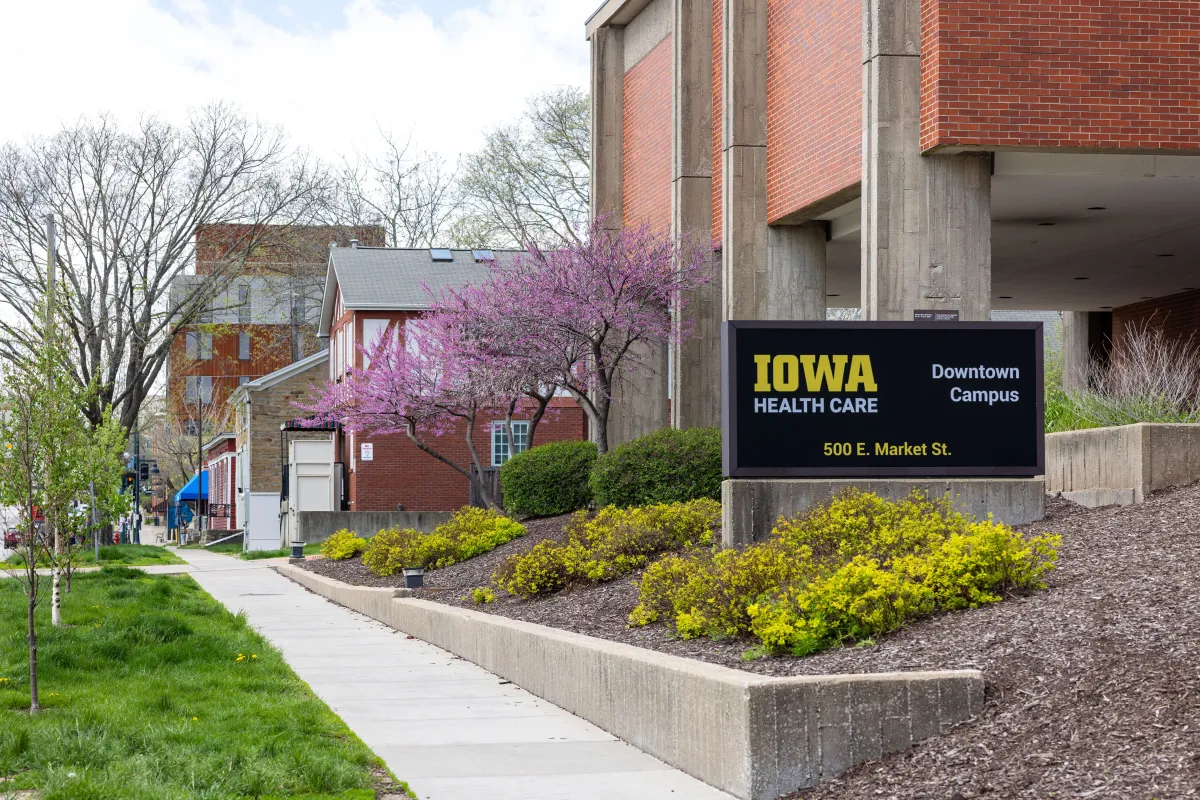 University of Iowa Health Care Medical Center Downtown with flowering trees in spring on Friday, April 19, 2024.