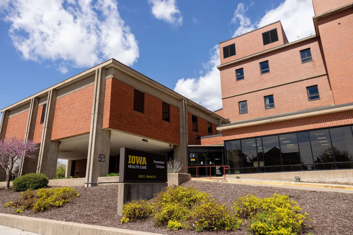 University of Iowa Health Care Medical Center Downtown with flowering trees in spring on Friday, April 19, 2024.