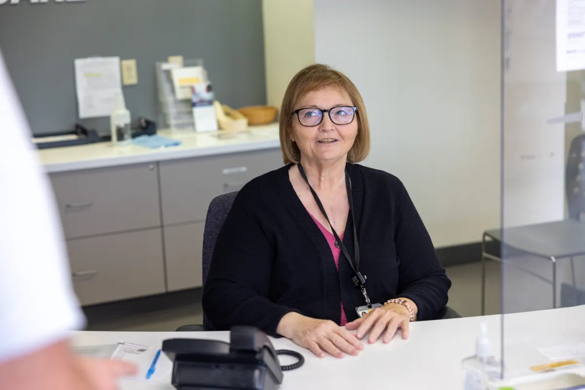 Simulated patient arrives at the information desk at UI Health Care’s downtown medical campus on Friday, June 13, 2025.