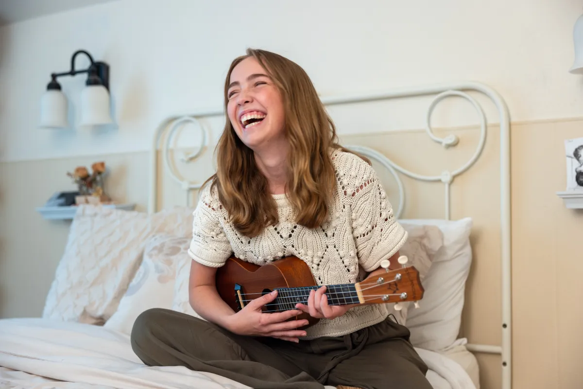 Grace Lidgett at home with her parents Tony and Amy on Thursday, July 31, 2025. Grace was diagnosed with cystic fibrosis as an infant, and through therapies that included Ofkambi and now Trikafta, has been able to live an active life that included running on her high school track and cross country teams.