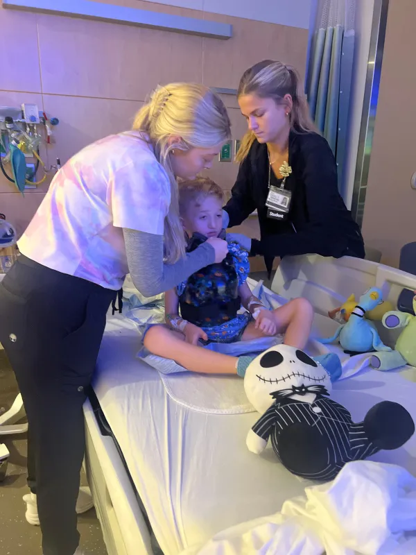 Kid Captain Luke Johnston and some members of his care team