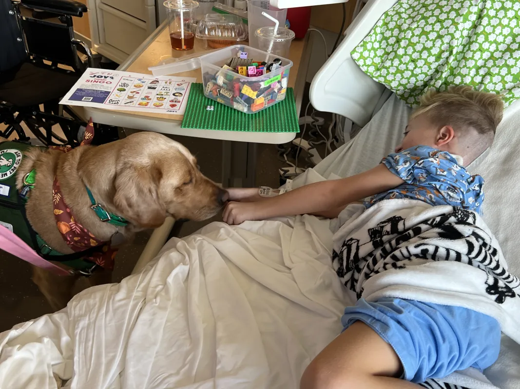 Kid Captain Luke Johnston and Stead Family Children's Hospital Facility Dog, Corrin