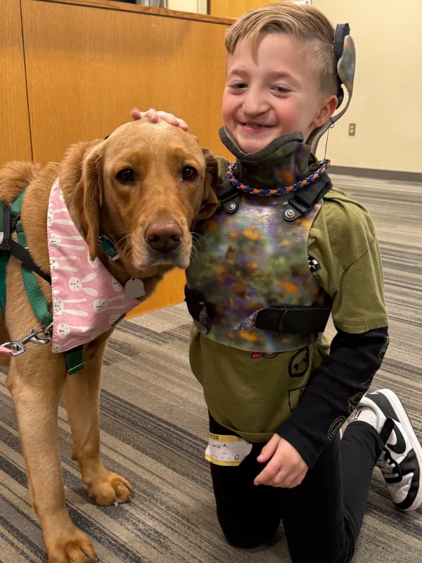 Kid Captain Luke Johnston and Facility Dog, Corrin