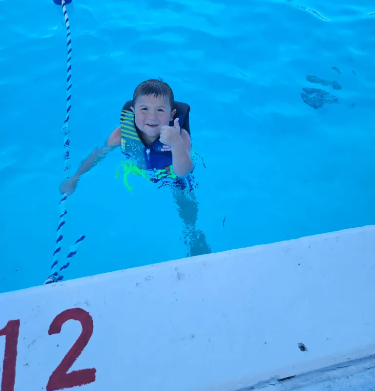 Kid Captain Micah Norby swimming