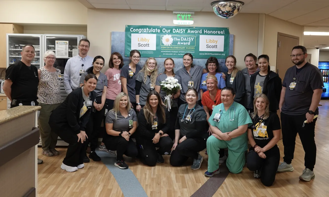Libby Scott (center) was nominated for a DAISY Award by her colleagues.