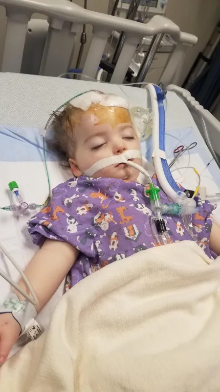 Kid captain Ray Walker lying in a hospital bed