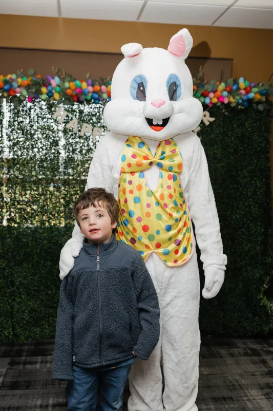 Kid captain Ray Walker standing next to Easter Bunny