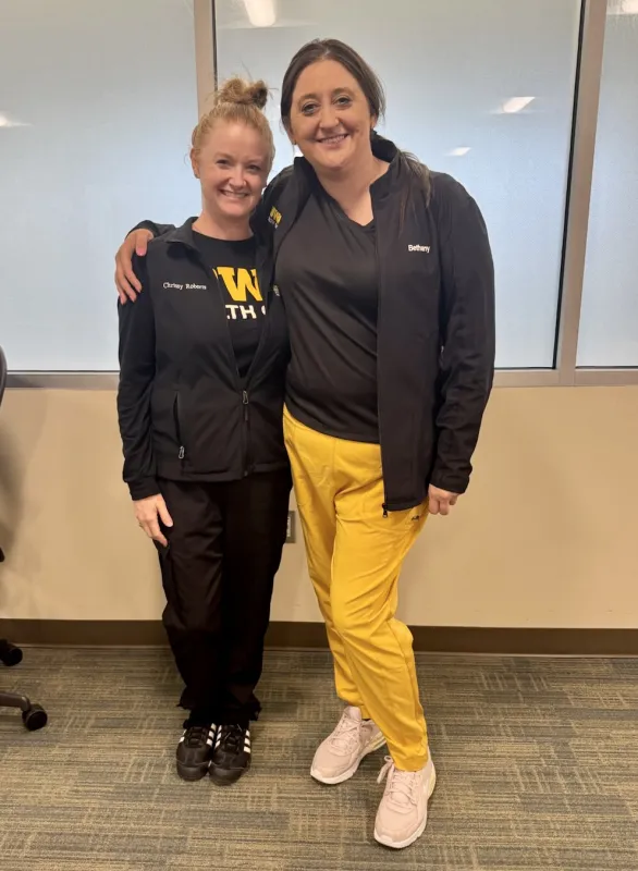 Bethany Husmann (right) with former UI Health Care employee and colleague Chrissy Roberts.