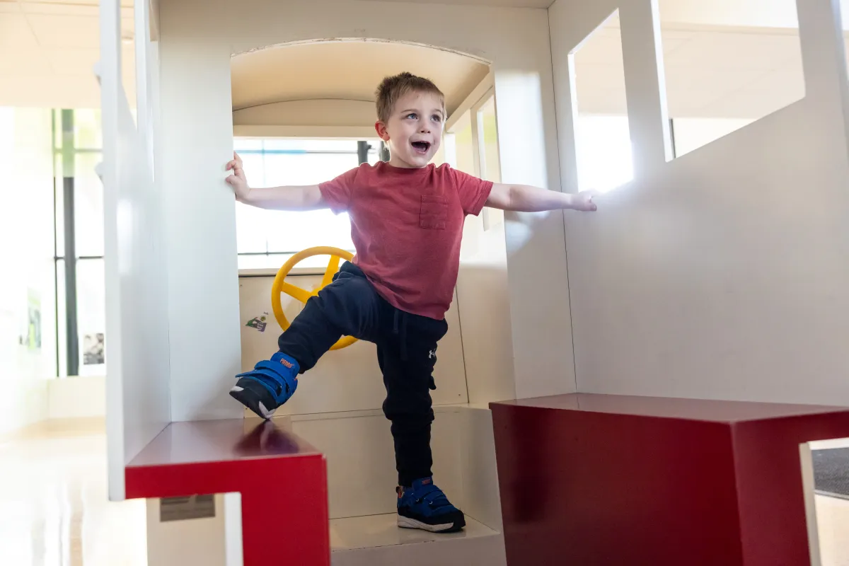 Sawyer Conrad, 5, plays with his parents Rachel and Hubert Conrad at UI Health Care Stead Family Children’s Hospital on Wednesday, March 18, 2026. Sawyer is seen through the multi specialty spasticity clinic for children, and was treated through a selective dorsal rhizotomy (SDR). 