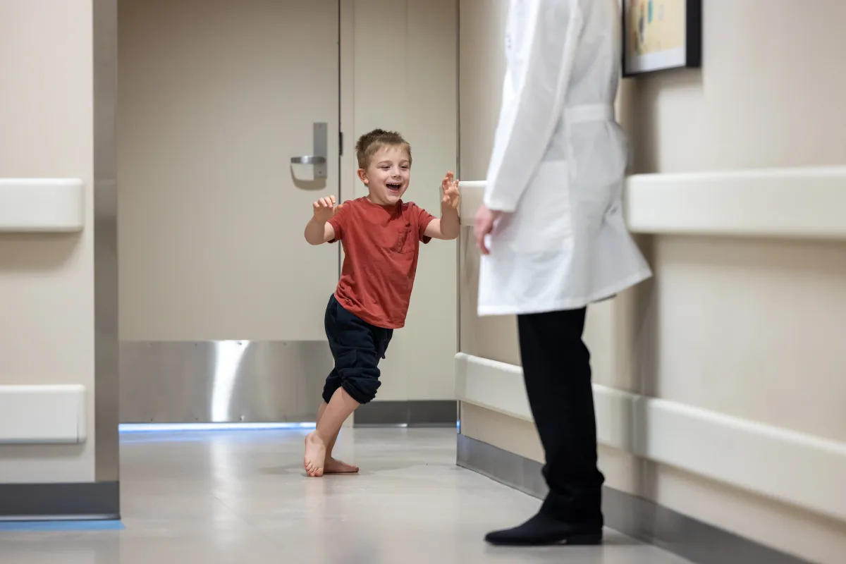 Sawyer Conrad, 5, plays with his parents Rachel and Hubert Conrad at UI Health Care Stead Family Children’s Hospital on Wednesday, March 18, 2026. Sawyer is seen through the multi specialty spasticity clinic for children, and was treated through a selective dorsal rhizotomy (SDR). 
