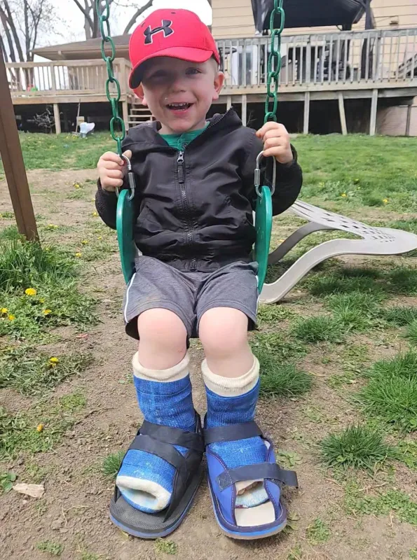 Conrad Sawyer on a swing