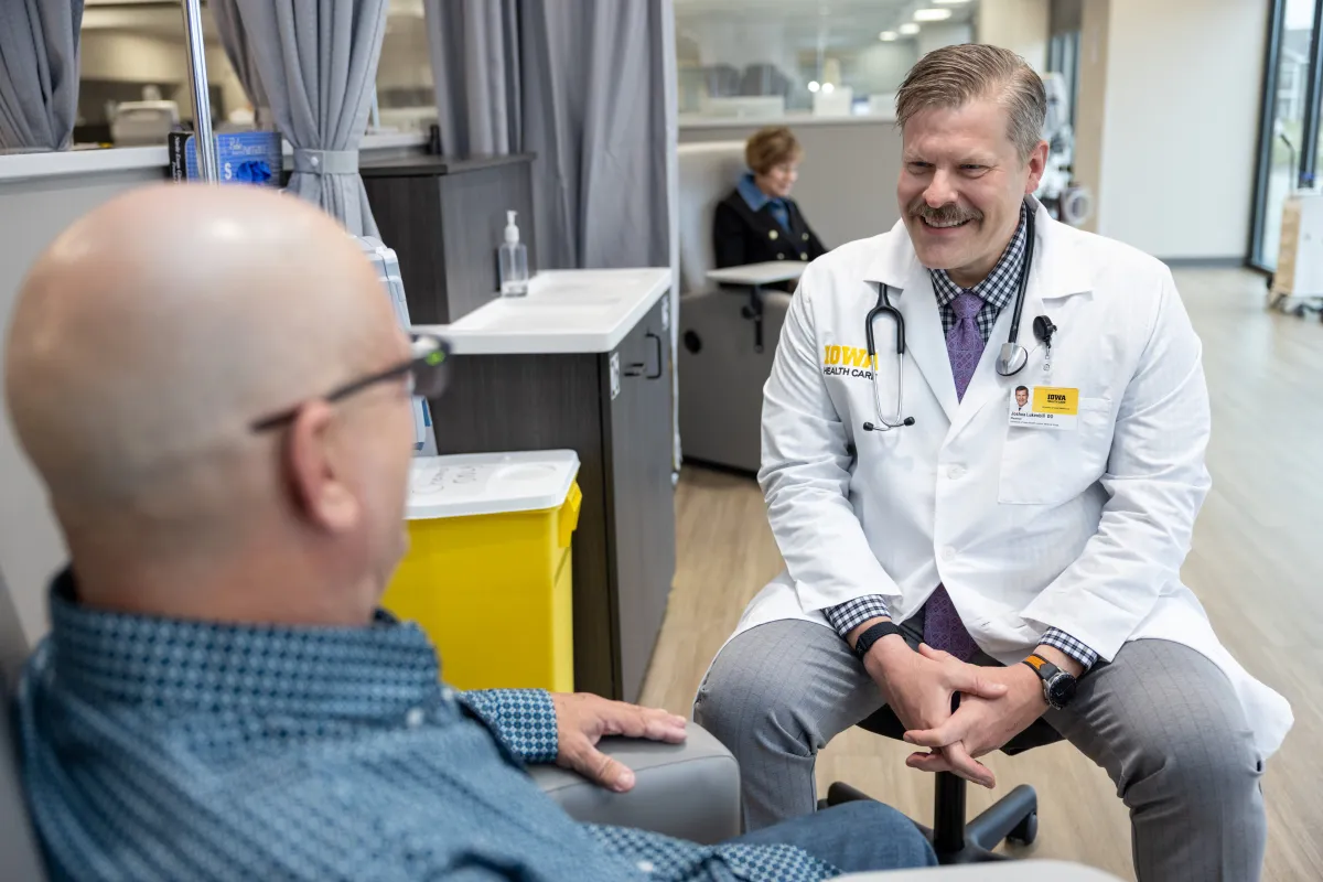 Joshua Lukenbill, DO, with patient at Mission Cancer + Blood - Waukee, part of UI Health Care, on Thursday, April 2, 2026. Patient consent on file.