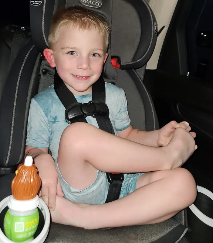 Sawyer Conrad sitting crosslegged