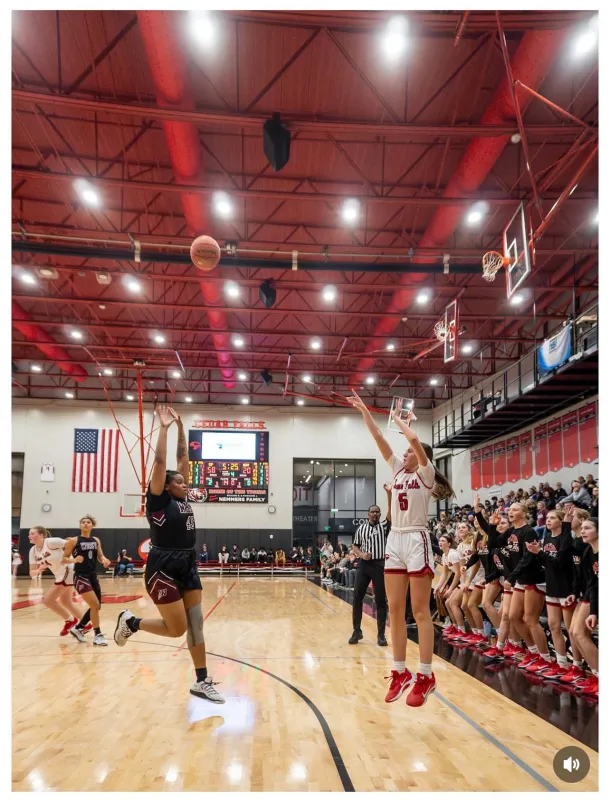 Mackenzie Sagers during a basketball game jumping while taking a shot