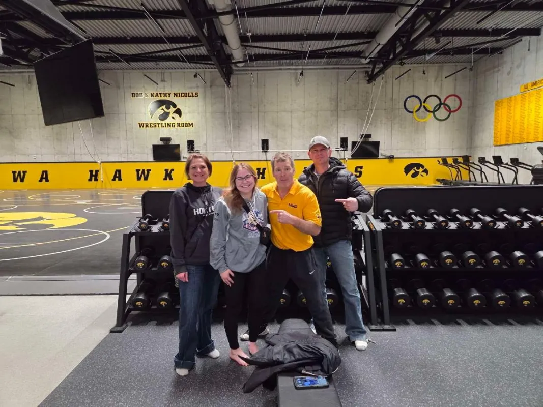 Keisha Tomac and family meet with Iowa wrestling coach Tom Brands