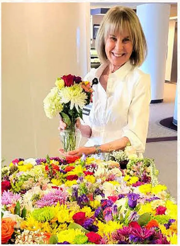 Volunteer holding flowers