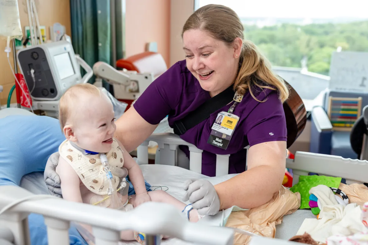 Image of a Music Therapist meeting with child