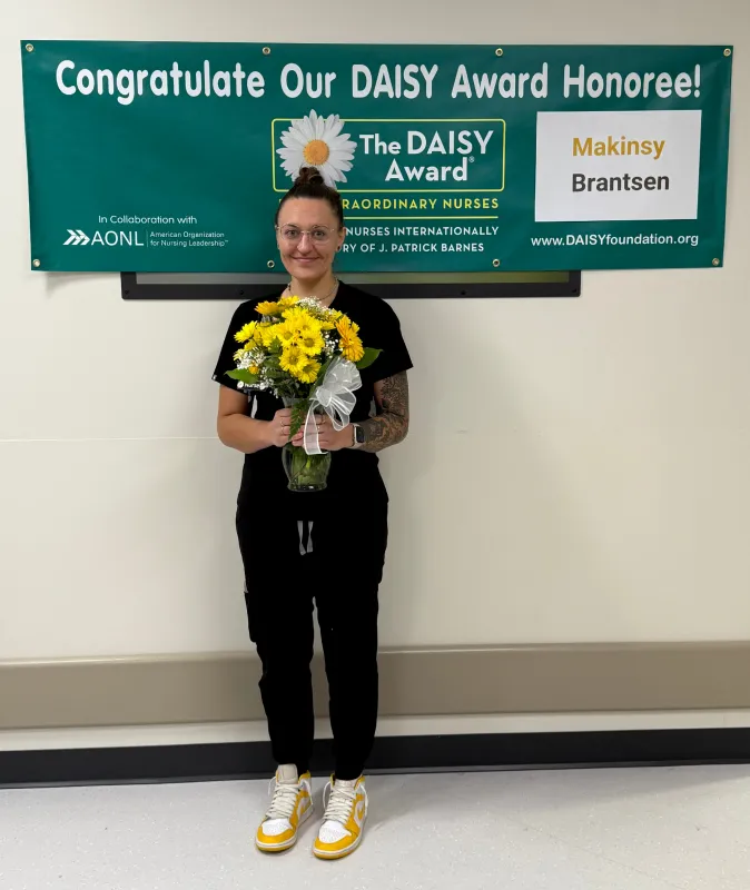 Mak Brantsen, BSN, RN, receives a Daisy Award.