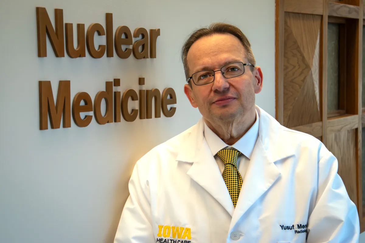Dr. Yusuf Menda in the Nuclear Medicine clinic . Menda is a professor in the UI Department of Radiology and its Division of Nuclear Medicine working on clinical trials of theranostics, which allows physicians to see and target specific receptors on cancerous cells, minimizing the impact on surrounding healthy tissue.