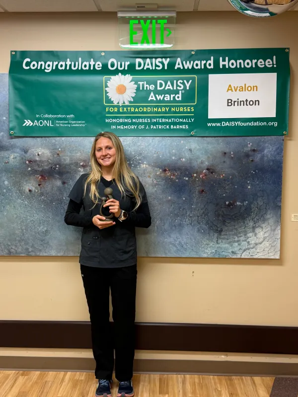 Avalon Brinton, BSN, RN, receives a daisy award.