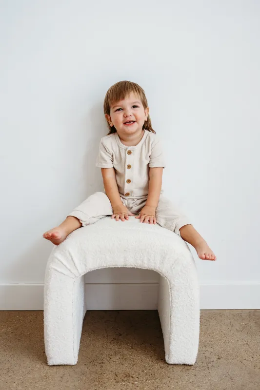 Bodhi smiling on a chair.