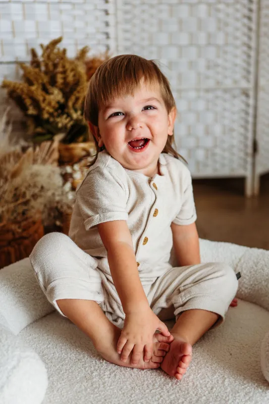 Bodhi laughing happily in his PJ's.