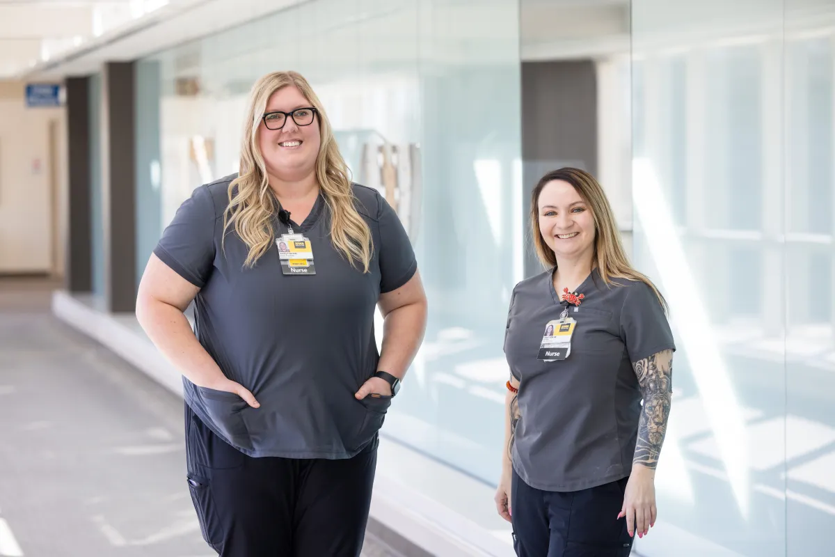 Ashley Price, an assistant nurse manager in the Behavioral Health Services division, photographed with Alexsis Lindenbusch on the UI Health Care university campus on Monday, March 9, 2026. 