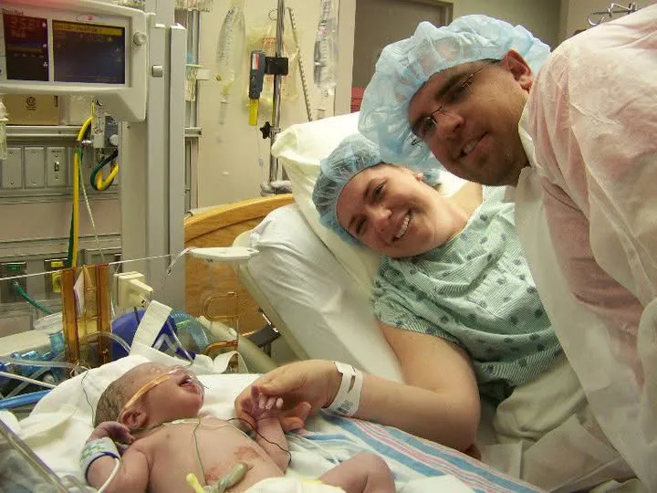Kid Captain Beau Harvey as baby in the hospital with his parents