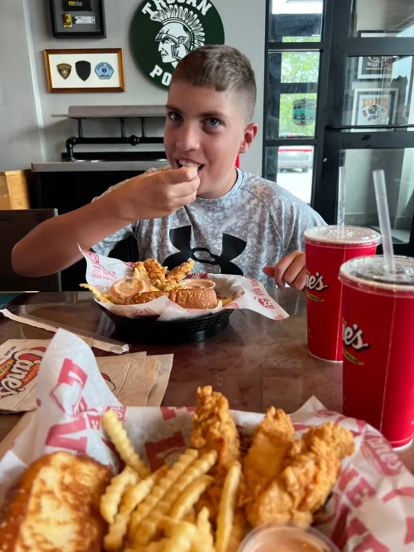Kid Captain Beau Harvey eating ou