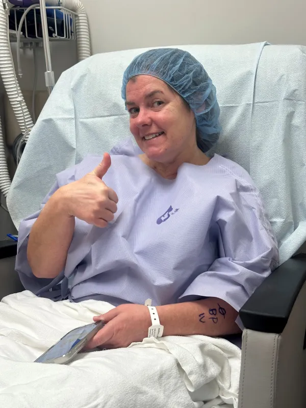 Amy Randall in a hospital bed