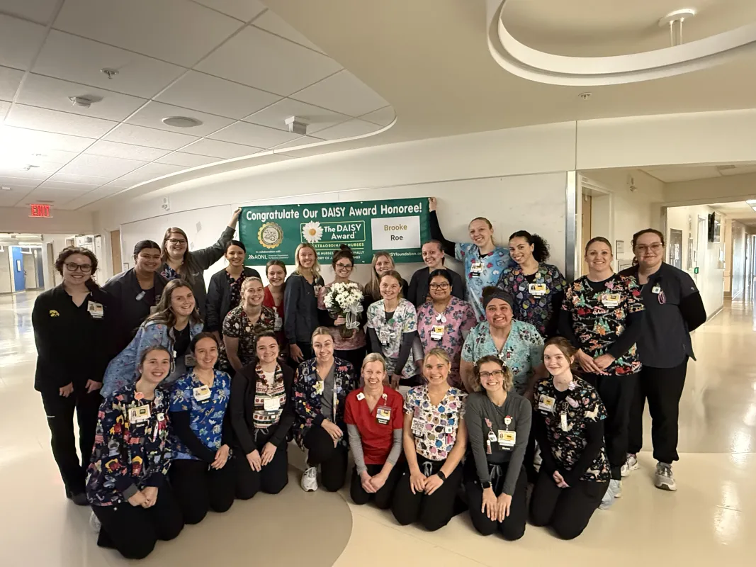 Brooke Roe, BSN, RN, accepting her DAISY award with her peers.