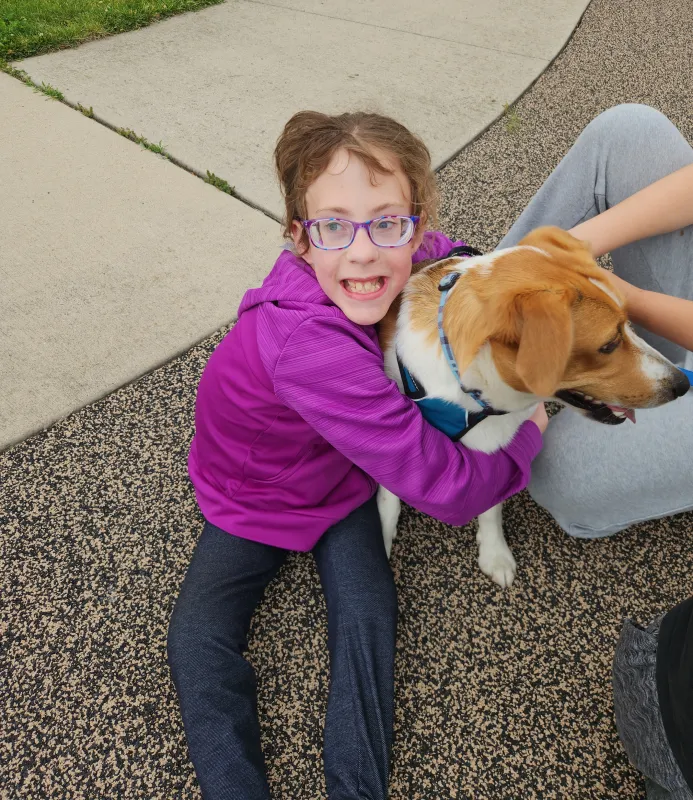 Kid Captain Eliana Gaul with a dog